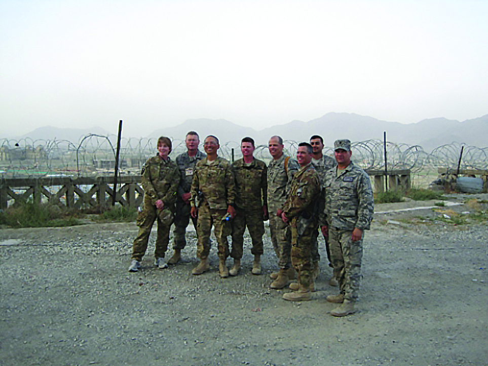 In June 2011, the Ministerial and General Staff Advisor Course
          took place at Camp Julien, Afghanistan (near the Tajbeg Palace,
          Kabul). The course provided valuable training for legal advisors
          and mentors to the Afghan National Army. Pictured left to right:
          COL Vivian Shafer, Col Eric Dillow, LTC Arthur Kaff, LTC Frank Hoare,
          CDR John Dezzani, LTC Thomas Bogar, CDR Nadeem Ahmad, Lt
          Col Daniel Bertsch. Their missions included mentoring the legal
          officers and other staff members of the Afghan National Army and
          contribute to the rule of law. They all believed in what they were
          doing. (Photo courtesy of Arthur Kaff)